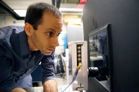 Guy Satat, a graduate student in the MIT Media Lab, at the fog machine