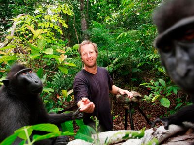Photographer David Slater posing with crested black macaque