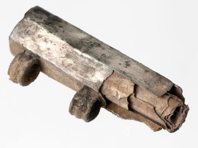 The silver amulet contained a thin foil scroll.