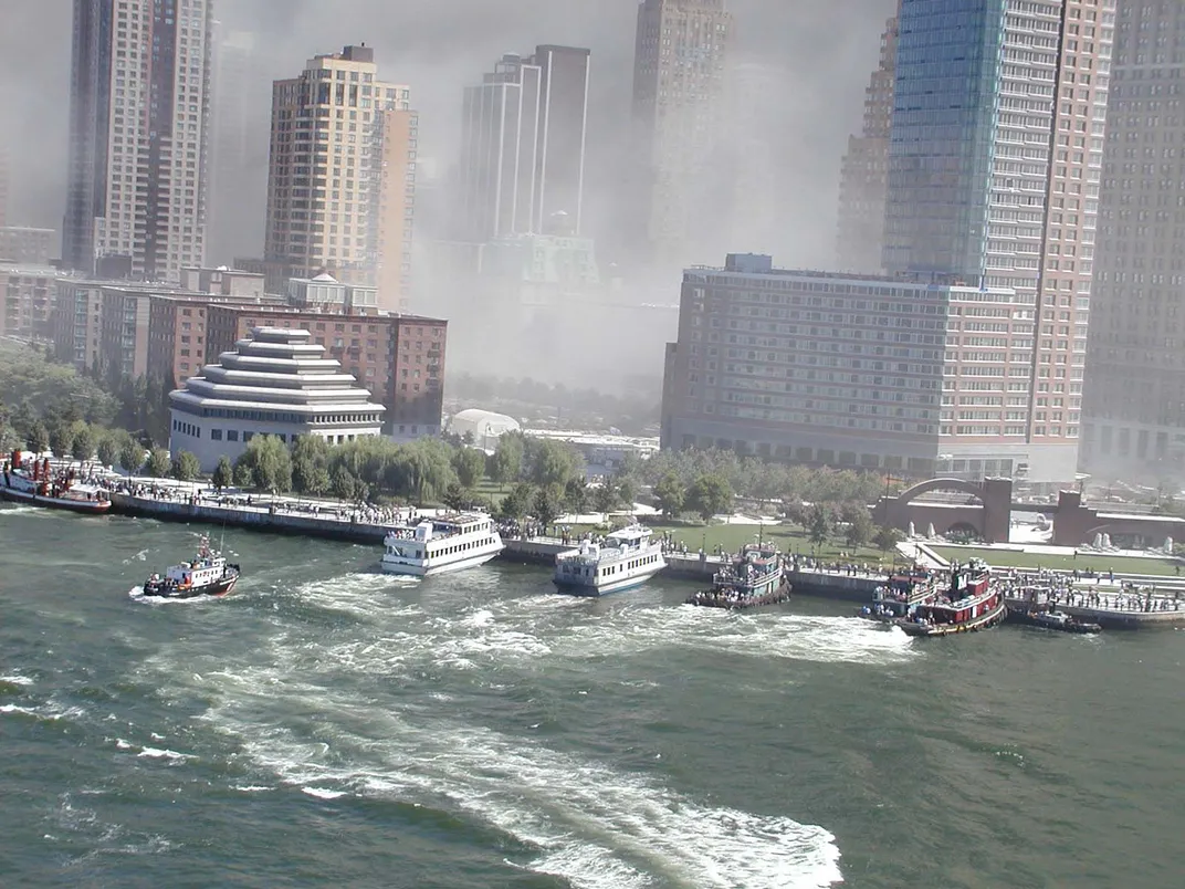 boats including a fireboat evacuating people