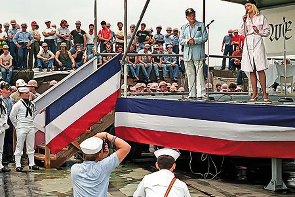 Actress Ann Jillian joins Hope in a duet on the Forrestal in 1984.