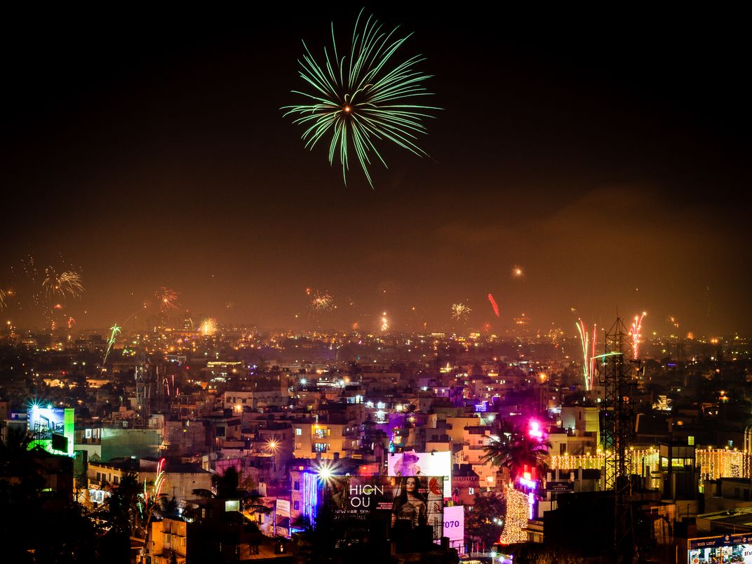 A colorful Diwali night in Bangalore. Caught one big fireworks in the  foreground and several small ones in the background in this long exposure.  | Smithsonian Photo Contest | Smithsonian Magazine