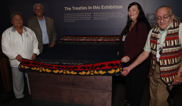 Delaware leaders prepare to unveil the Treaty of Fort Pitt, on view at the National Museum of the American Indian in Washington, D.C. From left to right: Denise Stonefish, chief of the Delaware Nation at Moraviantown; museum director Kevin Gover; Chester “Chet’ Brooks, chief of the Delaware Tribe of Indians; and Deborah Dotson, president of the Delaware Nation. May 10, 2018, Washington, D.C. (Paul Morigi/AP Images for the National Museum of the American Indian, Smithsonian)