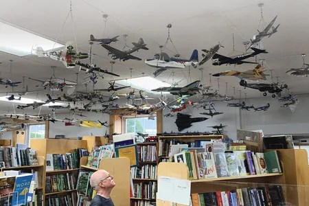 Standing among the used books in Peterborough’s Toadstool Bookshop, Bill Johnson contemplates his creations, constructed over his lifetime.