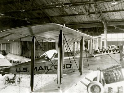 A DH-4 mailplane sits in the hangar at Bellefonte, Pennsylvania, in December 1923.