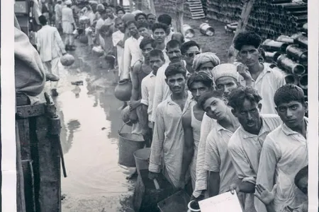 Refugees wait for water at a camp in Delhi. The partition of India put millions on the move. 