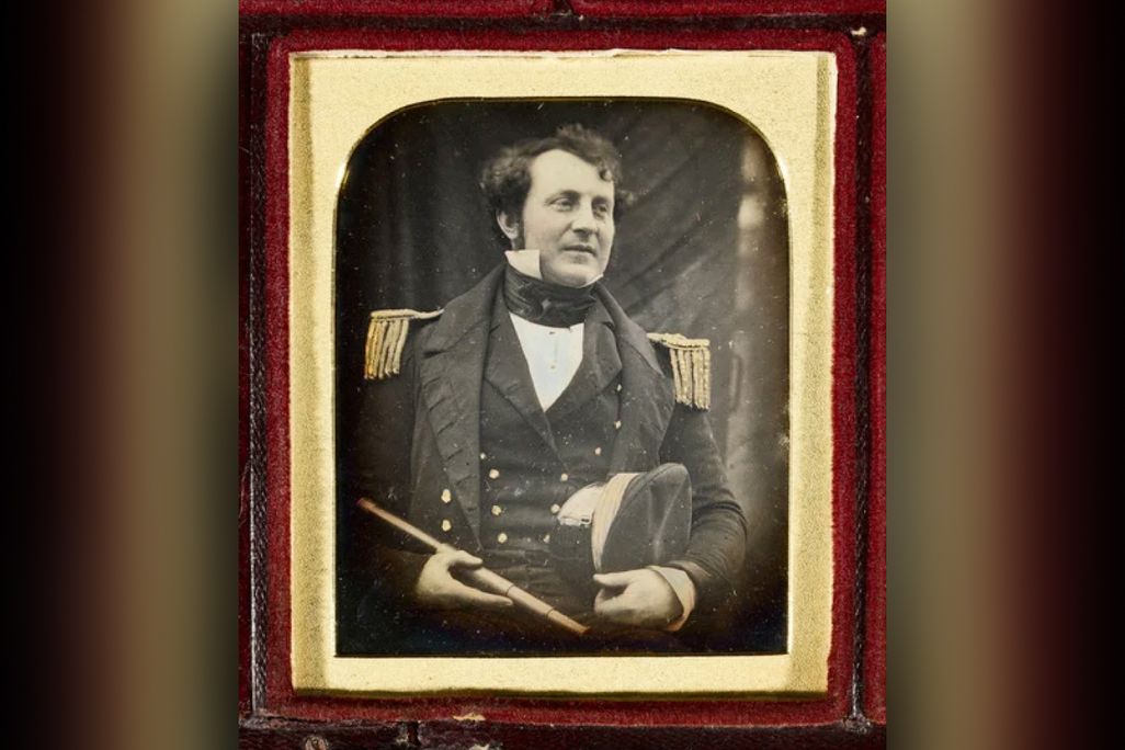 Black and white portrait of a man in uniform
