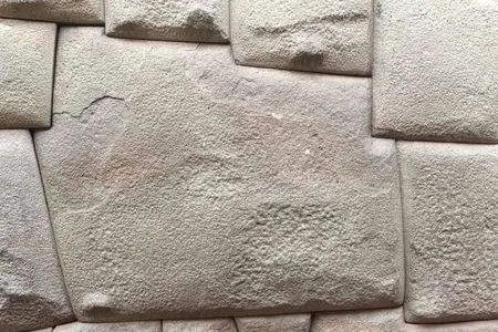 A man attacked the stone with a metal object.