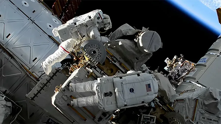 Astronauts working on space station