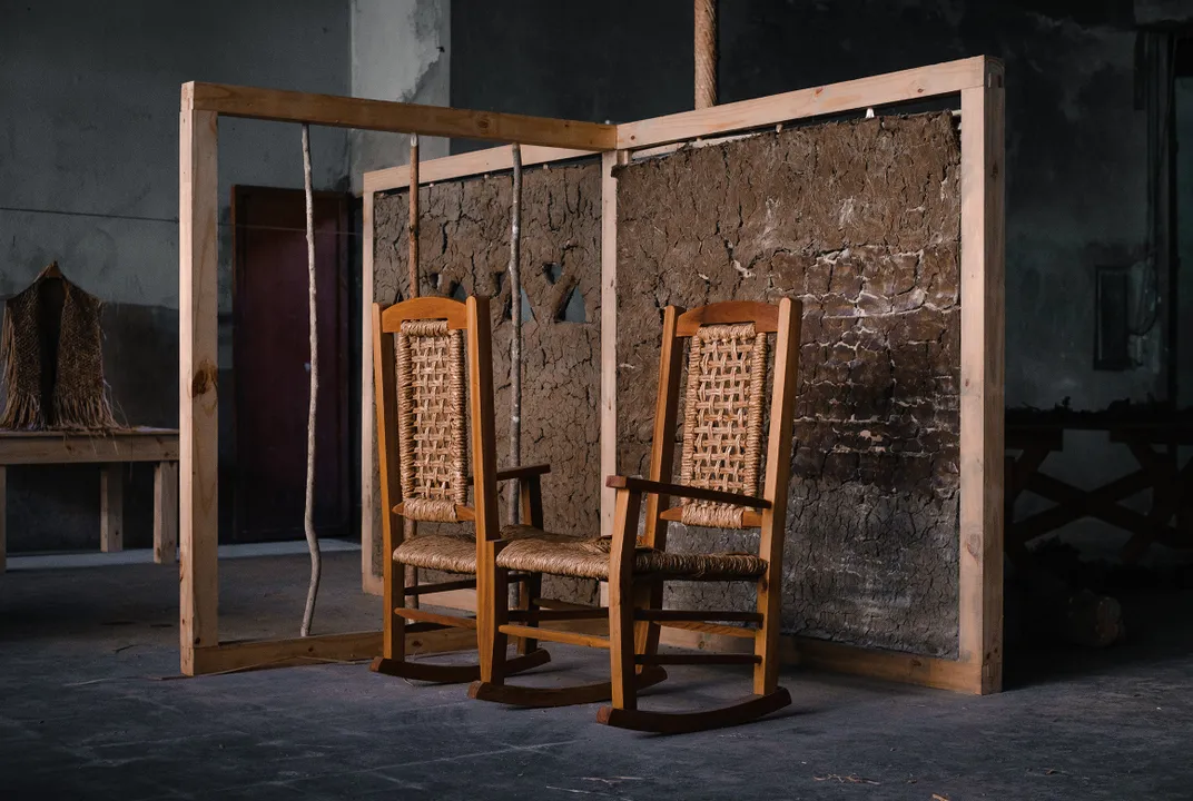 two rocking chairs sit on display