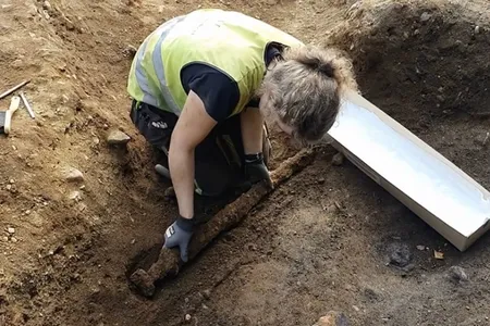 The 1,100-year-old sword found in Norway measures about three feet long.