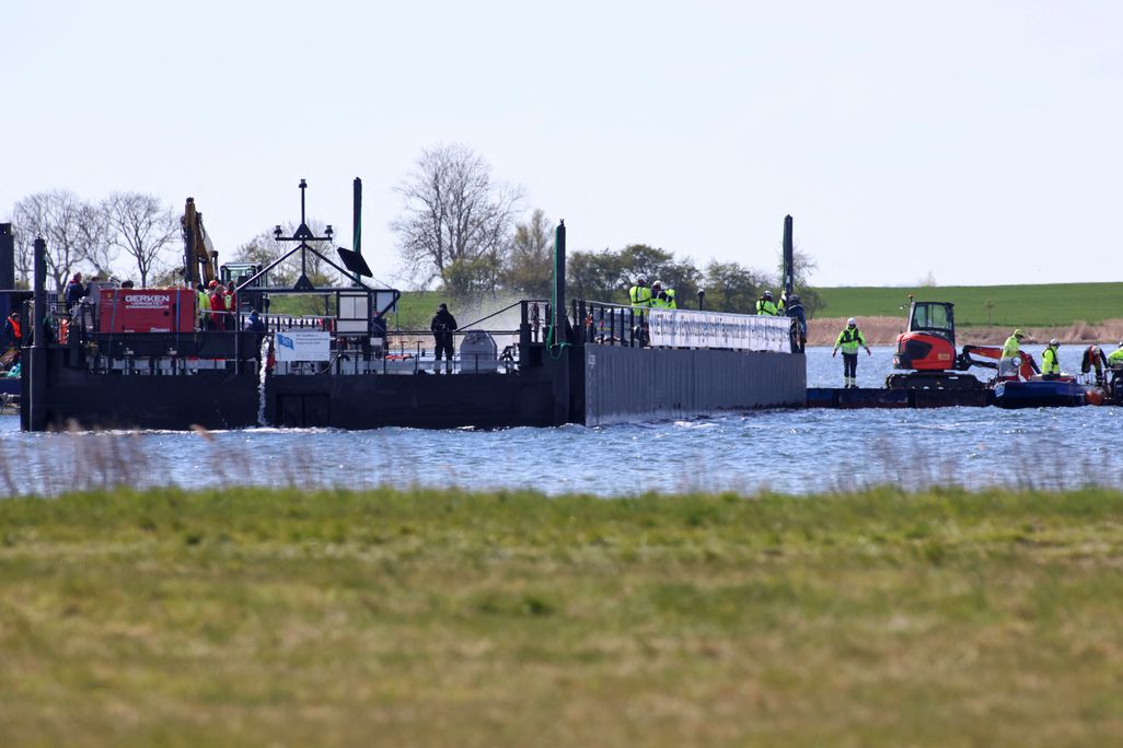 a rescue team on a special barge in the water