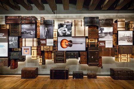A wall of suitcases and photos inside the National Blues Museum.