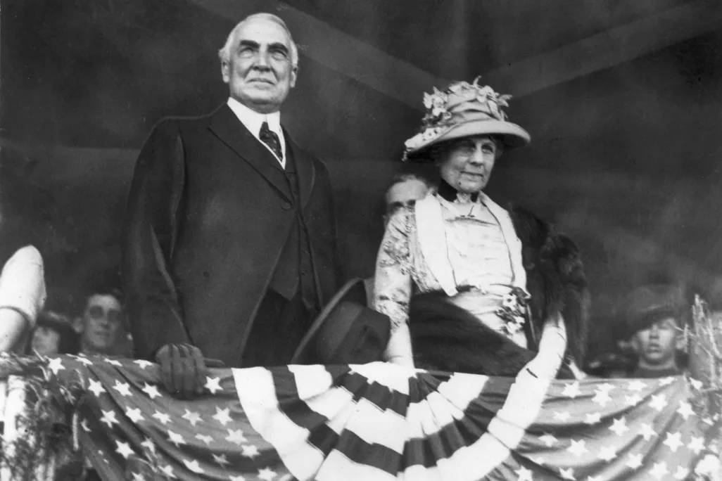 Warren Harding and his wife above patriot bunting