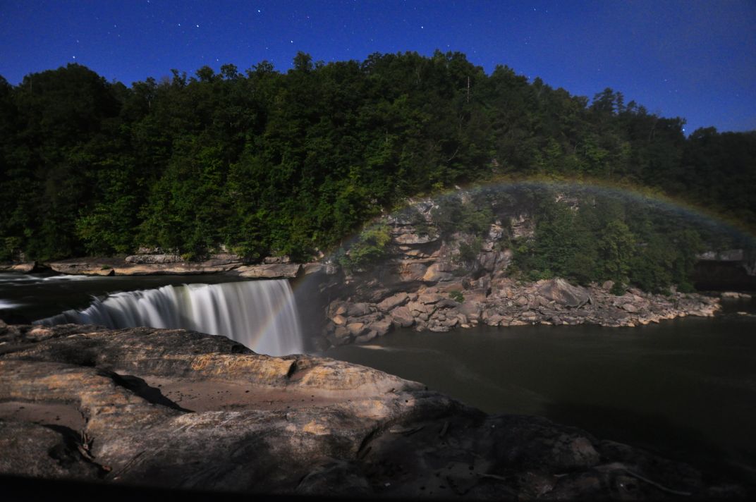 A moonbow rainbow appears over Cumberland Falls, Corbin, KY