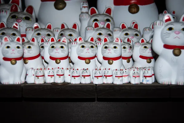 beckoning cat figurines at the Gotokuji Temple in Tokyo, Japan thumbnail