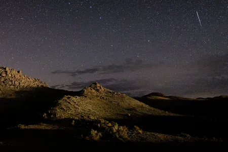 A meteor streaks across the sky near Lone Pine, California, during the annual Perseid meteor shower in 2022.