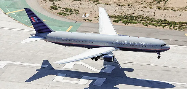 A Boeing 767-300 lands on Los Angeles International Airport’s runway 25L.