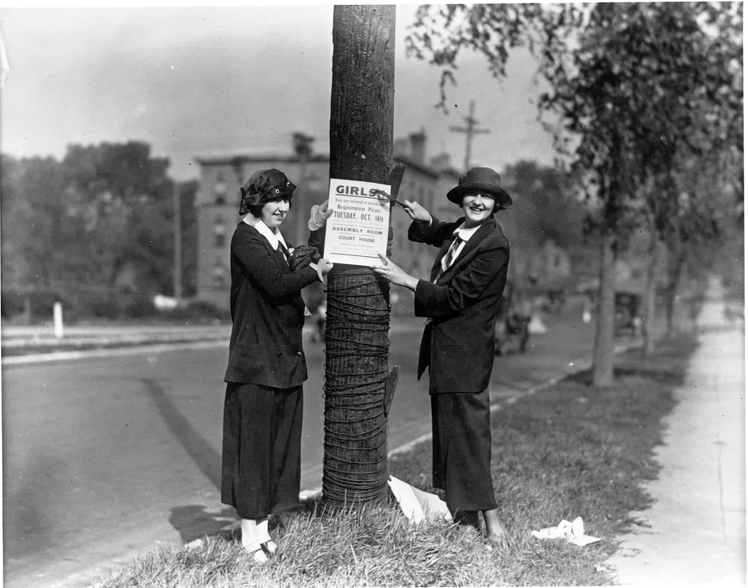 League Women Voters post notices of a picnic to register female voters
