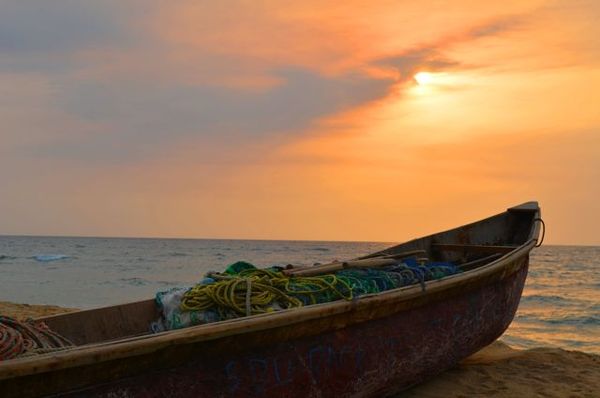 Sunset in the fishing, surfing, and expat beach village of Robertsport, Liberia. thumbnail