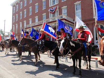 Riders outside the Patee House Museum in St. Joseph, Missouri, the route's eastern terminus. Every year the National Pony Express Association conducts an annual re-ride of the famous delivery route. 