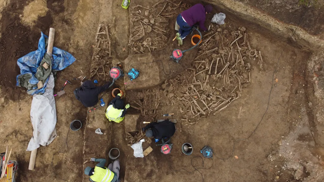 Overhead view of human bones at archaeological site