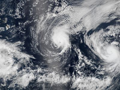 A NASA satellite image shows Hurricane Iselle approaching Hawaii, with Hurricane Julio hot on its heels.
