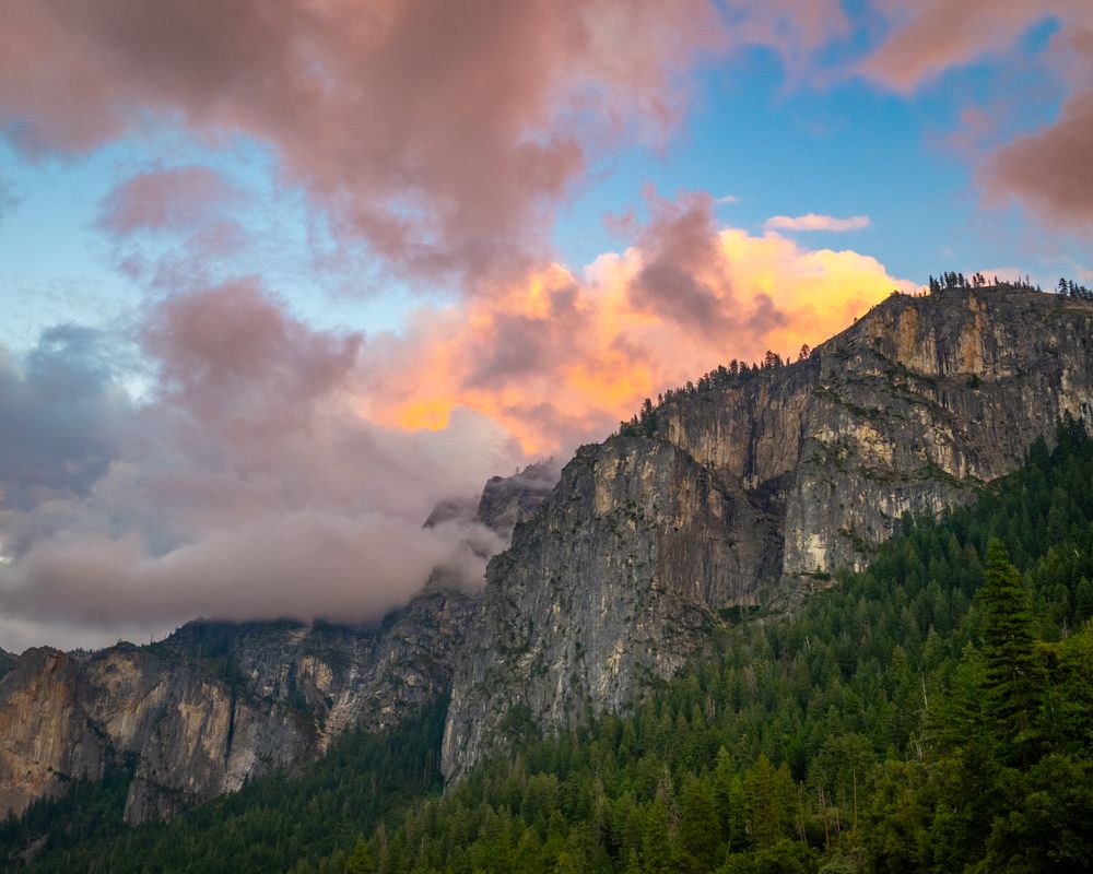 I was photographing Tunnel View in Yosemite National Park. Sunset was starting to take over the clouds. I looked to my right and the sunset made the clouds over the mountain range look as if they were on fire. Another example of not getting caught up with tunnel vision and look around you!