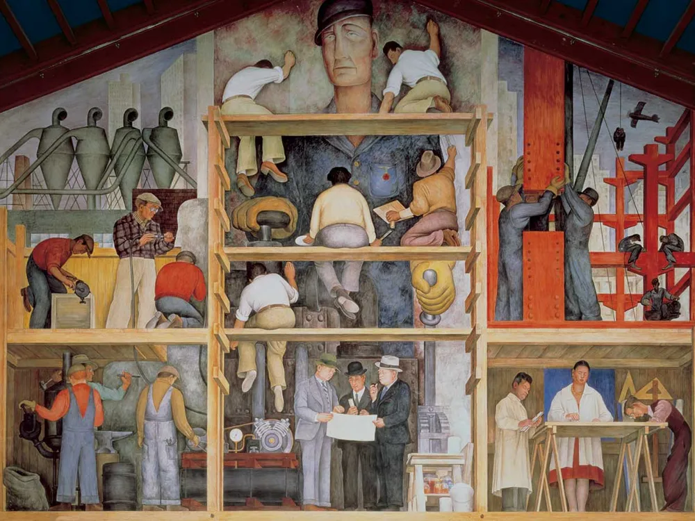 A large mural that contains scaffolding separating many levels, with workers in overalls and industry prominently featured; a white worker in a blue cap looms larger-than-life in the background over the busy scene