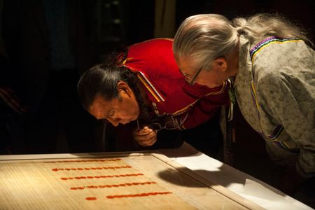 Faithkeeper of the Turtle Clan of the Onondaga Nation of the Haudenosaunee Confederacy Oren Lyons, Ph.D., (right), and The Tadodaho of the Haudenosaunee Confederacy Chief Sidney Hill, examine a treaty at the National Museum of the American Indian