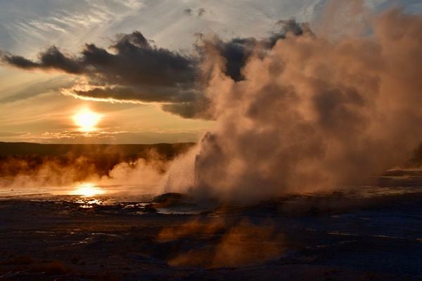 Sunset at Clepsydra Geyser in Yellowstone thumbnail