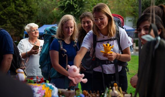 Visitors pick out crochet toys to purchase at the My Handmade Armenia Festival.