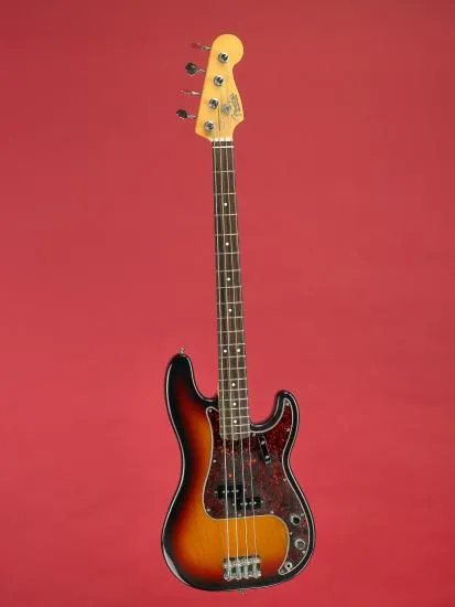 Brown guitar against red background