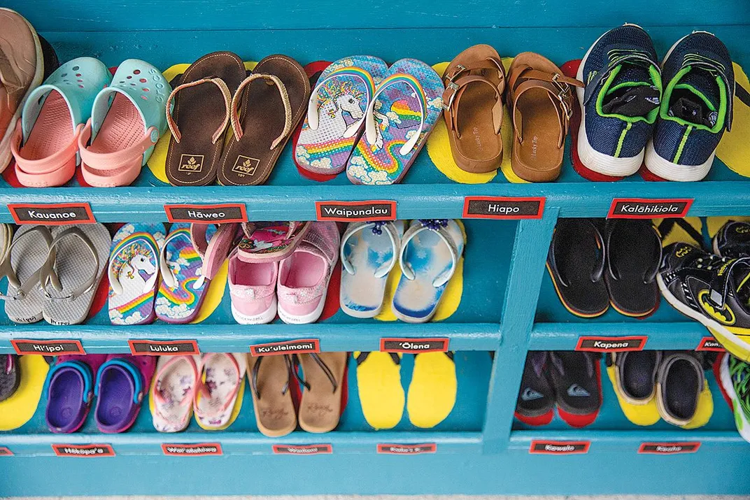 A shoe rack with children's shoes