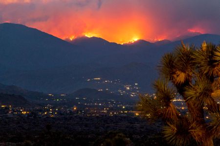 Flames and smoke cover the hillsides near Yucca Valley in California during a June wildfire.