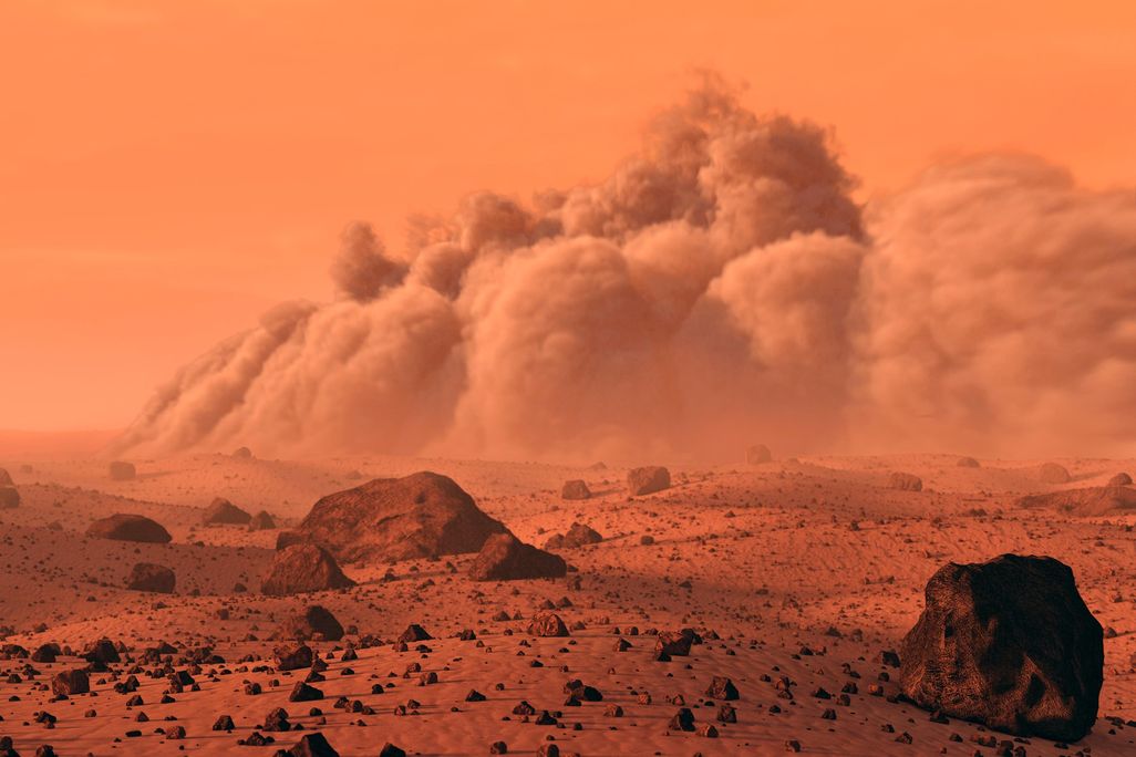 An auburn-colored ominous Martian landscape with a dust cloud rolling in. 