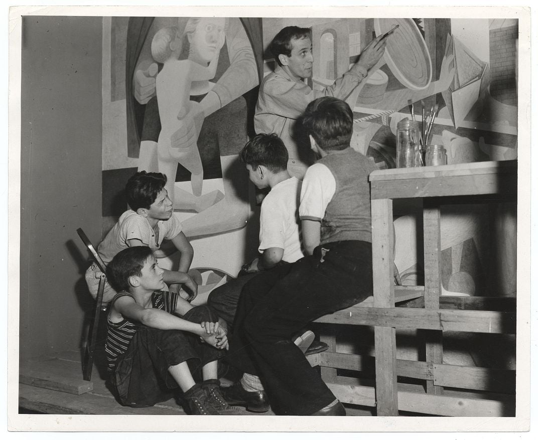 Philip Guston painting a mural in 1940