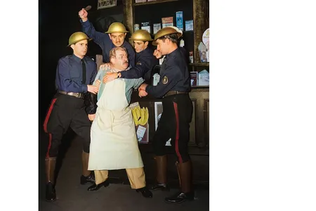 The fictional Corpo Guard detains a shopkeeper in Sinclair Lewis&rsquo; play It Can&rsquo;t Happen Here.