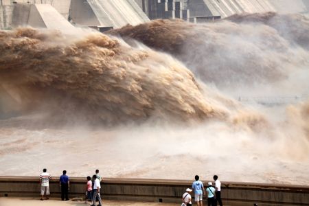 Floodwaters gushing through a dam on the Yellow River. 