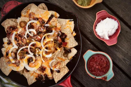 Chorizo nachos are just one of the many delicious options for spicing up Sunday's game.