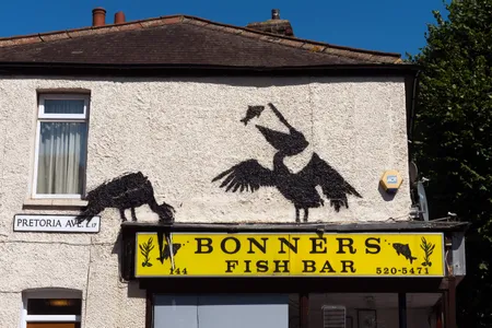 Banksy&#39;s latest mural, which depicts two pelicans eating fish,&nbsp;on August 9.