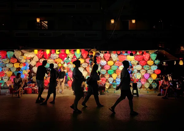 Silhouettes Passing the Lantern Market thumbnail