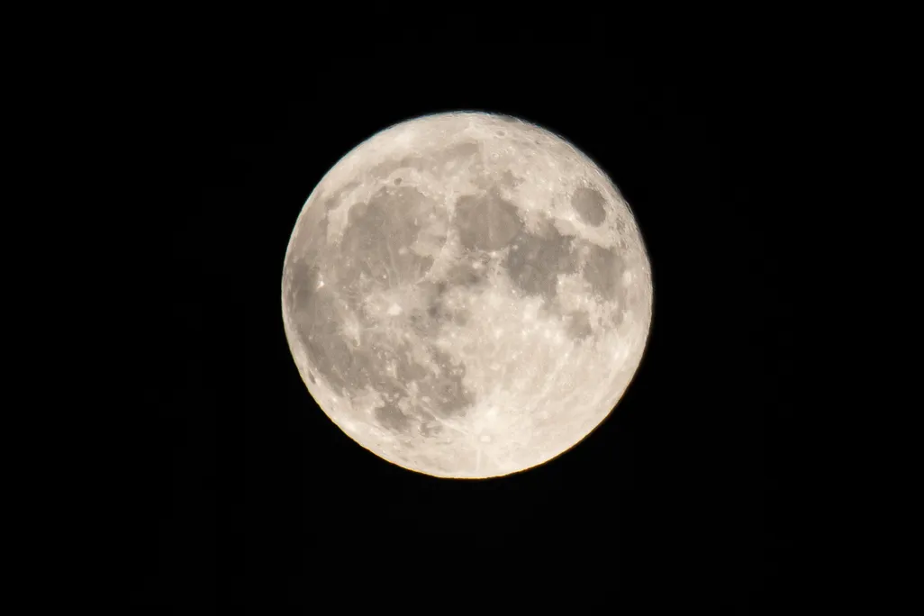 The Full Corn Moon as seen behind Hortiatis mountain over the city of Thessaloniki in Northern Greece, captured from Kalochori Lagoon and National Park. 