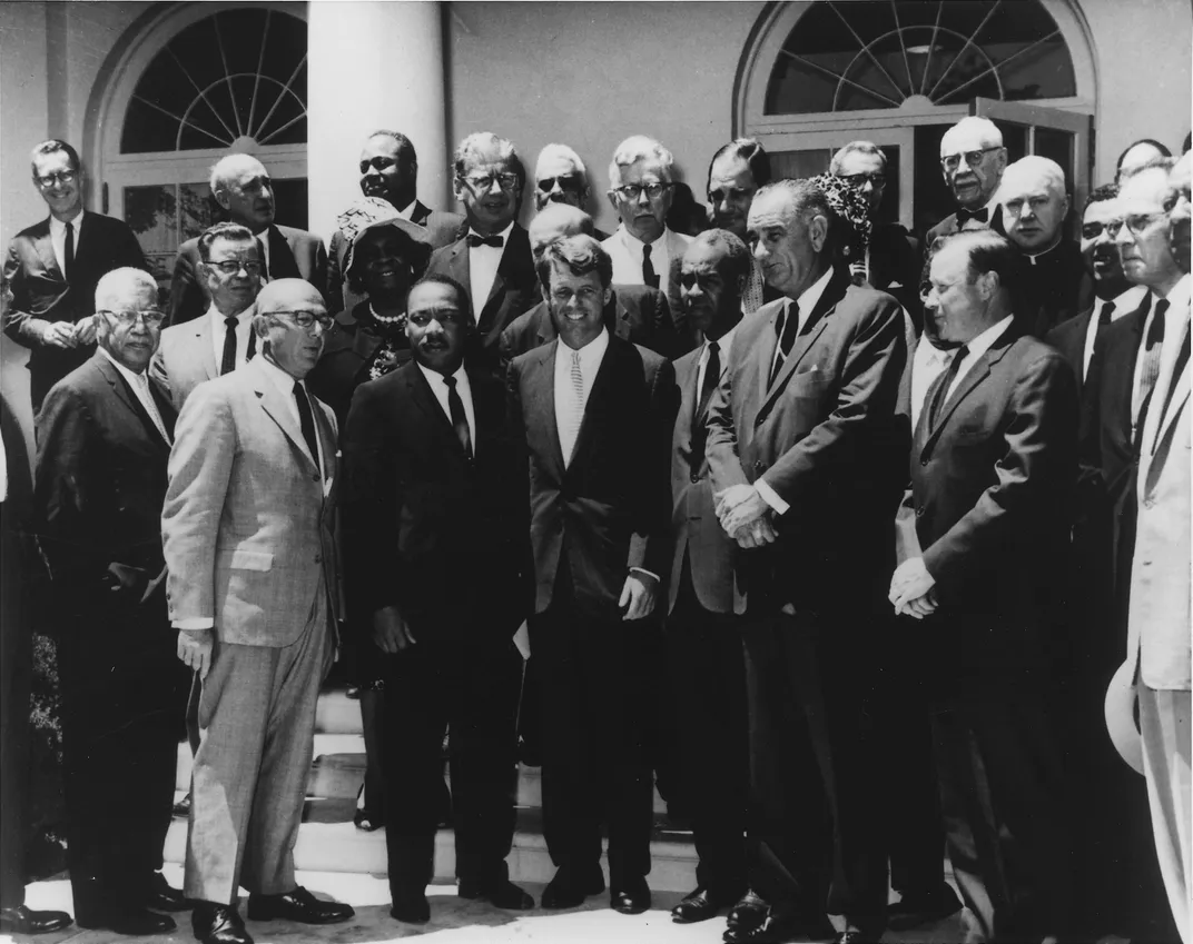 Robert F. Kennedy (center, front row) and Lyndon B. Johnson (right of Kennedy) meet with civil rights leaders, including Martin Luther King Jr.