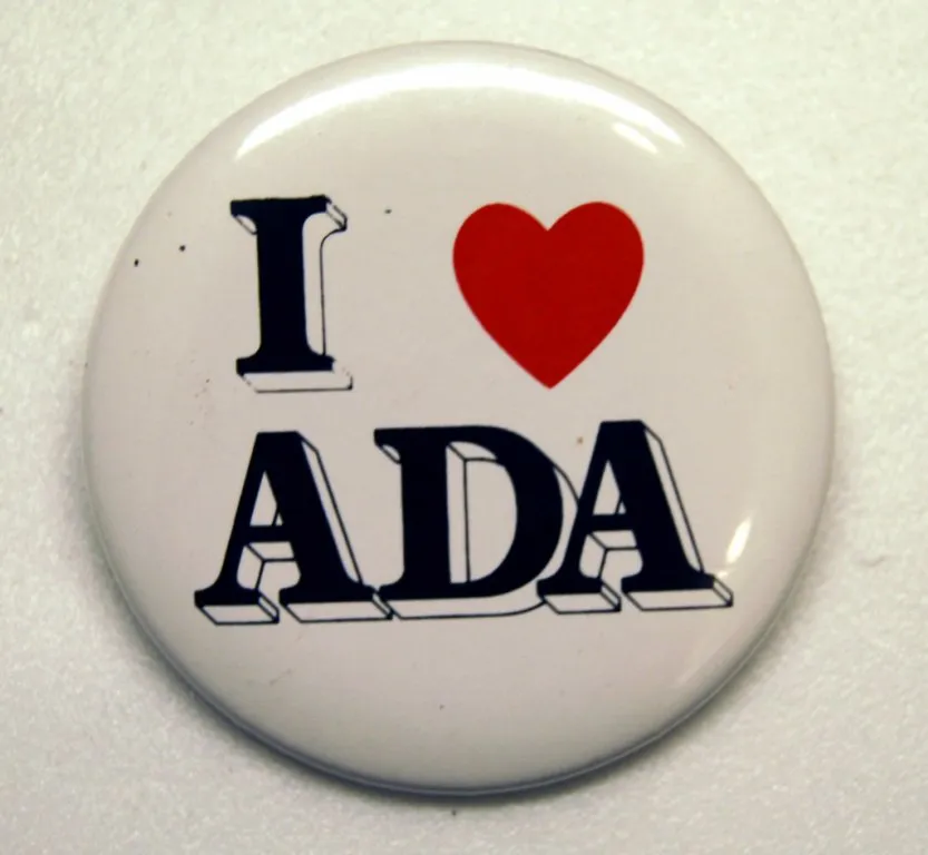 A white button with black text that reads, "I [red heart symbol] the ADA."