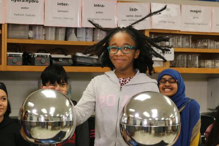 Moments that highlight the joy and excitement of scientific inquiry—such as this student using a Van de Graaff generator—can spark interest in a STEM-related career. Here are some career-focused resources that can supplement that interest. (National Air and Space Museum)