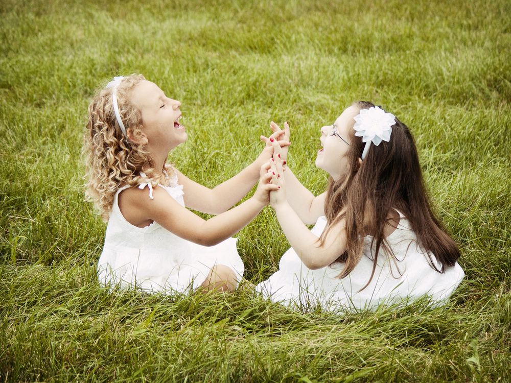 two little girls best friends holding hands
