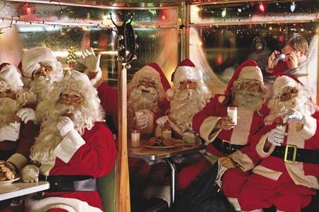 "Very seldom do a bunch of Santas get together," says Jerry Clarke, the right-most Santa, who manages apartments by day.