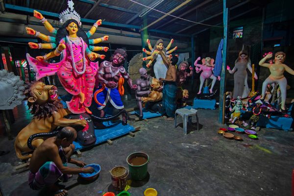 Artisans painting Durga idols thumbnail