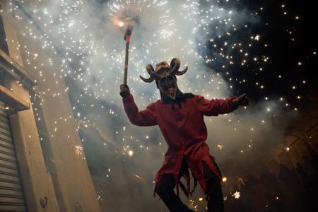 A devil burns gunpowder during the festival of Els Foguerons de Sa Pobla.